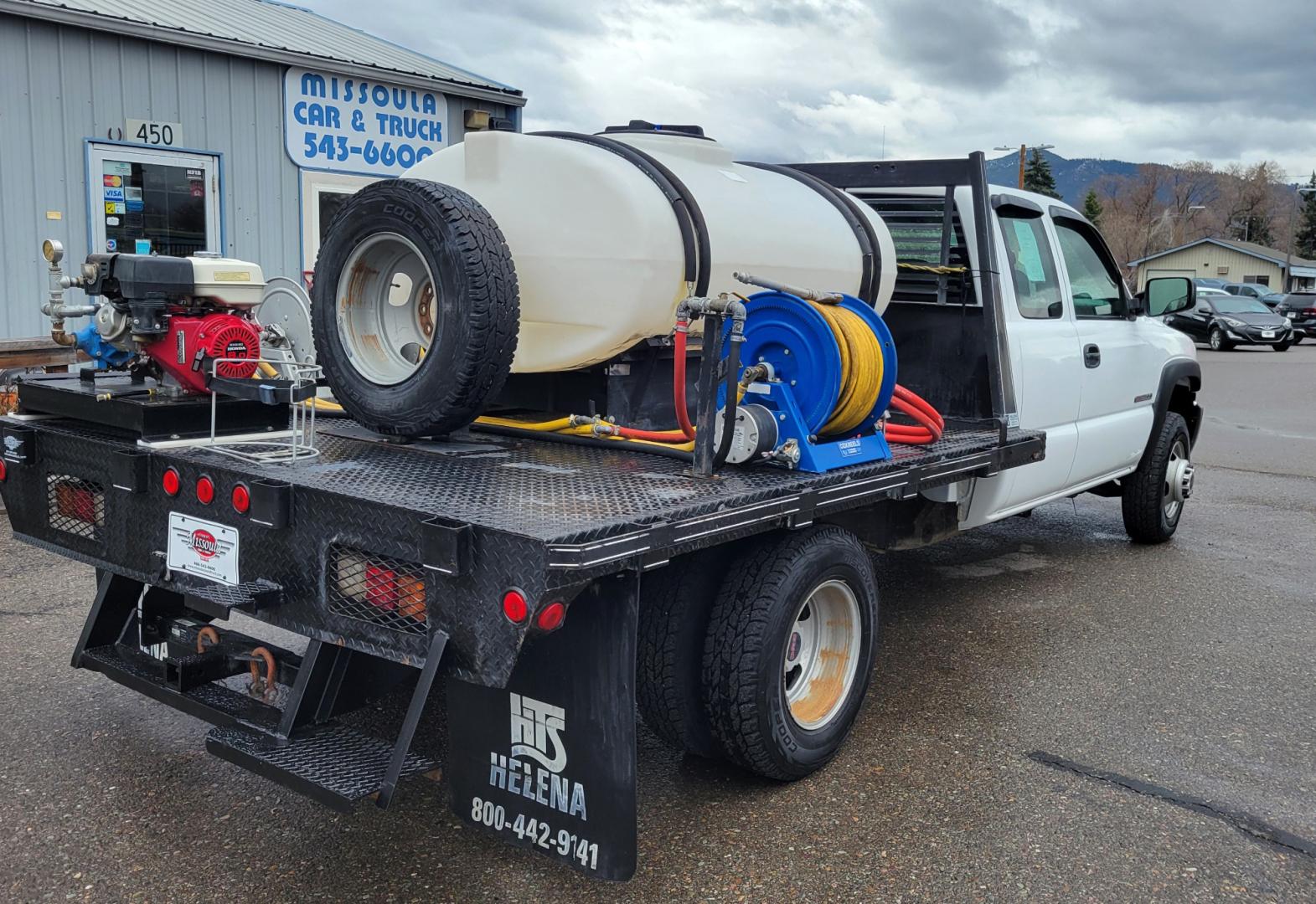 2005 White /Black GMC Sierra 3500 Ext. Cab 4WD (1GDJK39G65E) with an 8.1L V8 OHV 16V engine, Automatic transmission, located at 450 N Russell, Missoula, MT, 59801, (406) 543-6600, 46.874496, -114.017433 - Photo#7